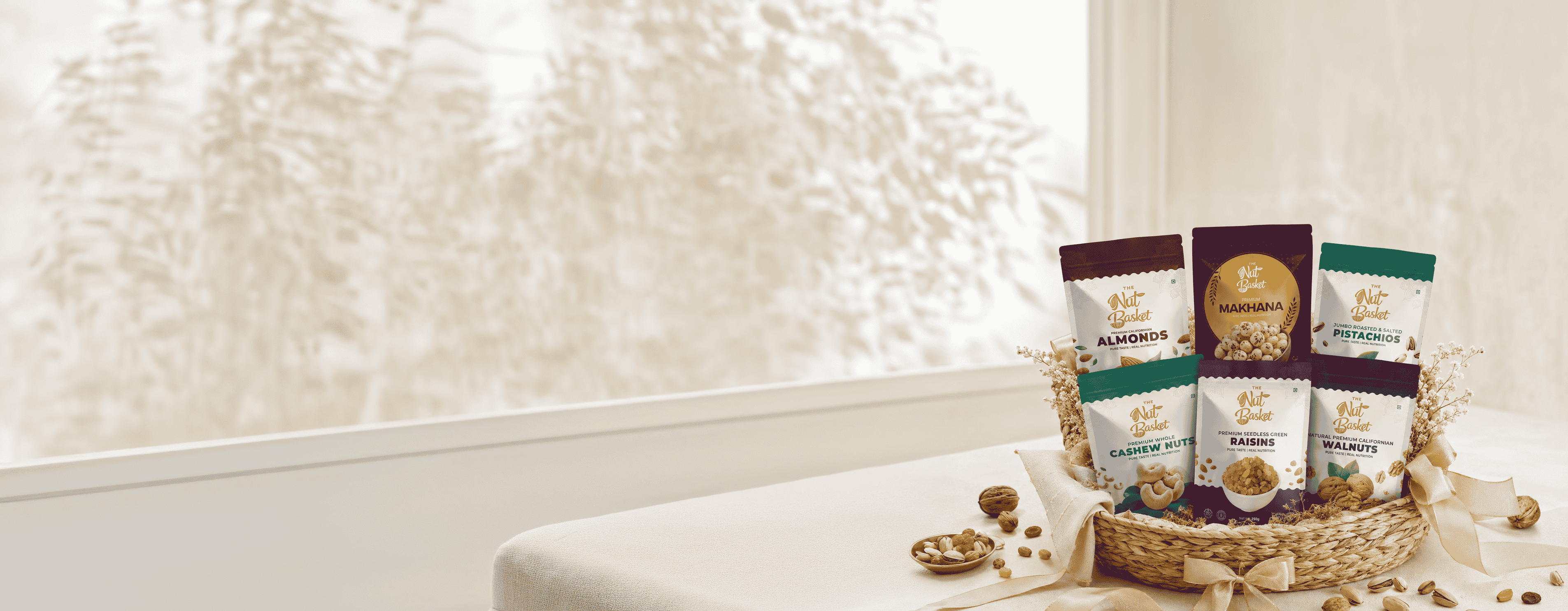 Premium gifting hamper with mixed dry fruits in wooden bowls and gift packaging